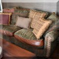 F13. Leather and fabric loveseat from Domain Furniture. 68&rdquo;w 